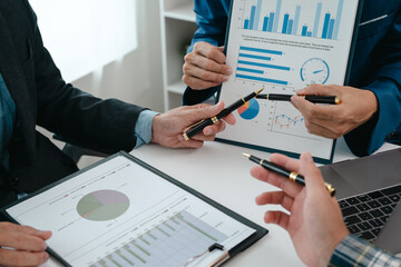 A team of young entrepreneurs and Asian startups held a business meeting. to achieve the marketing...