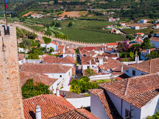 Amazing view of Obidos, with the typical white houses and the internal battlements of the medieval walls, Oeste region, Portugal
