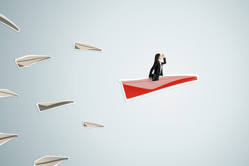 Side view of young businesswoman flying on abstract red paper plane on light background. Leadership, journey, discovery and career concept.