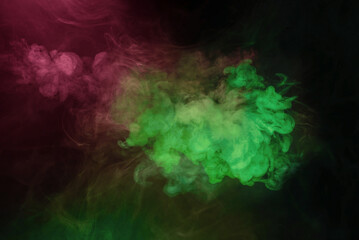 Fototapeta na wymiar Green and pink steam on a black background.