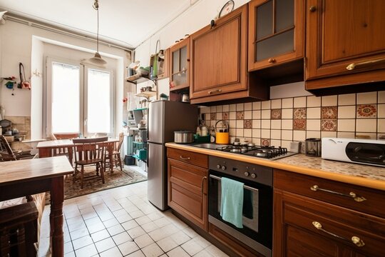 Affordable apartment kitchen with gas boiler and cooker. Generative AI