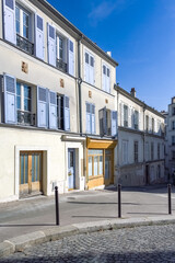 Fototapeta na wymiar Paris, houses and street, typical buildings in Montmartre 