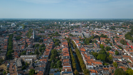 Fototapeta na wymiar Drone footage of historical Dutch city Gouda. aerial image of Netherlands urban skyline with houses, church and streets