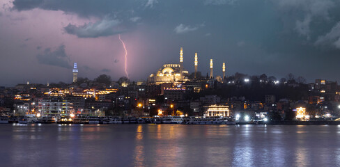 Fototapeta na wymiar New Halic Metro Bridge at summer night blue sky and city lights in Istanbul, Turkey