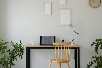 Mobile app wireframe on laptop screen on desk in home office