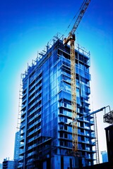 Fototapeta premium A skyscraper with a construction crane on top created with Generative AI technology