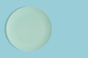  Bamboo plate on blue background.