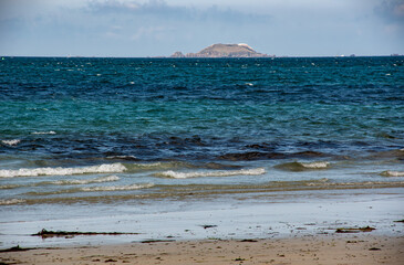 Scenic View of the Sea, Coastline, and Île Rouzic from Perros-Guirec Beach, Brittany, France in Summer