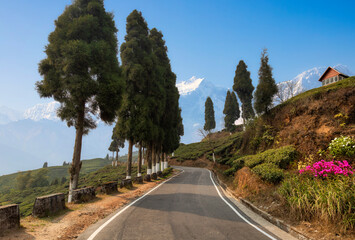 A scenic mountain road with view of Kanchenjunga Himalaya range at Darjeeling, India
