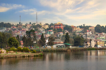 Mirik lake with its cityscape at sunset. Mirik is a popular tourist destination in Darjeeling district of West Bengal, India.