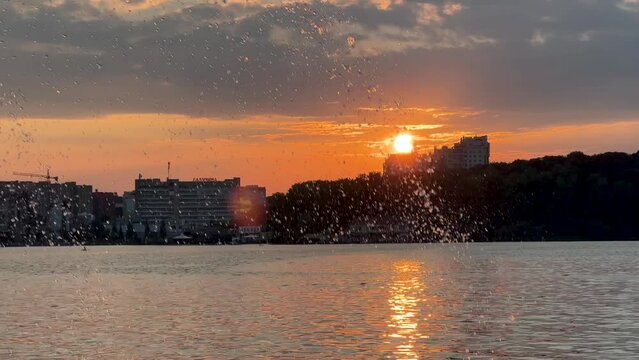 Ternopil lake embankment with evening sunset and sky