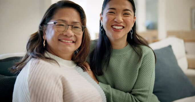 Happy, sofa and face of woman with her senior mother talking, bonding and laughing for funny joke. Smile, love and portrait of an Asian female person with her elderly mom in the living room at home.