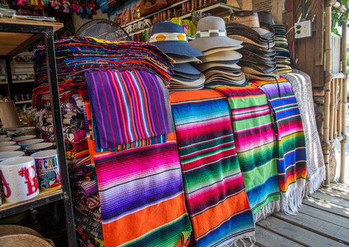 selling sarapes, cups and hats as Mexican crafts in the streets of Todos Santos, a magical town in La Paz. Mexico