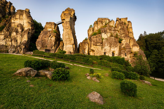 Beautiful light falls on the Externsteine stones at sunrise, near Detmold, Teutoburg Forest, Germany