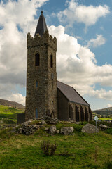 Fototapeta na wymiar Picturesque St. Columba's Church in Glencolumbkille under a dramatic sky, County Donegal, Ireland