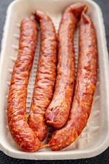 smoked sausage meat pork, beef, fresh appetizer meal food snack on the table copy space food...