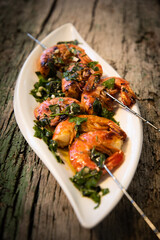 tasty fresh shrimp skewers on plate