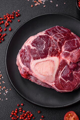 Fresh beef ossobuco steak with salt, spices and herbs