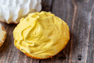 Closeup, lemon flavor meringue cake on wooden table