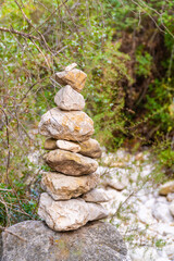 Monolith with stones stacked on a rock.