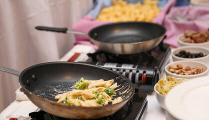 Sizzling culinary artistry in a hot frypan, epitomizing the joy and creativity of home cooking
