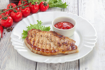 Grilled pork steak with ketchup