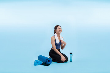 Fototapeta na wymiar Athletic and sporty asian woman resting after intensive cardio workout training. Healthy exercising and fit body care lifestyle pursuit in studio shot isolated background. Vigorous