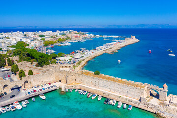 Fototapeta premium Mandraki port with fort of St. Nicholas and windmills, Rhodes, Greece. 