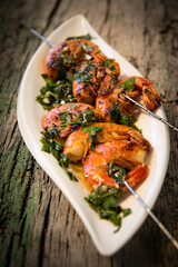 tasty fresh shrimp skewers on plate