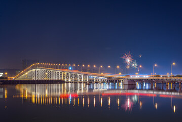 Night view of the Governador Nobre de Carvalho Bridge with fireworks