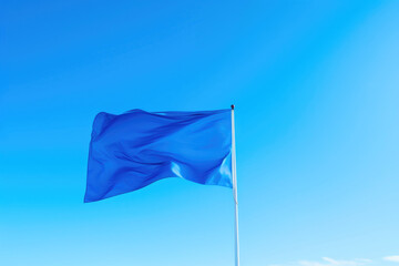 Blue Flag Billowing Under a Clear Sky