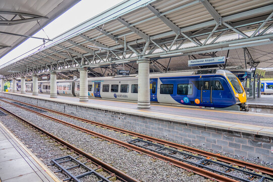 Northern train at a platform at Manchester Airport