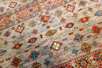 Istanbul, Turkey - July 22,2023: Intricate designs of Turkish rugs on display on the streets of Istanbul
