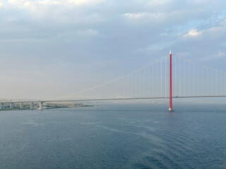 Istanbul, Turkey - July 22,2023: Turkey's 1915 suspension bridge over the Dardanelles Straight seen from the water
