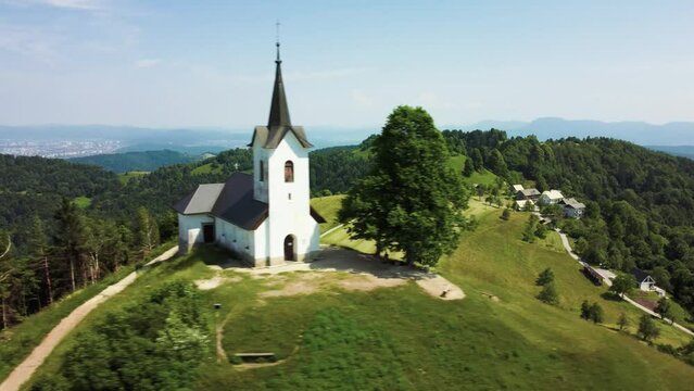 Drone Aerial View Sveti Jakob Church On Top Of Green Hills, Slovenia.