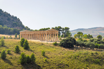 Fototapeta na wymiar The Doric temple of Segesta with the surrounding landscape. The archaeological site at Sicily, Italy, Europe.
