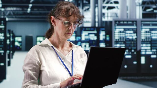 Knowledgeable supervisor looking around advanced data center, preparing to start comission on damaged high tech blade servers in order to ensure optimal operations