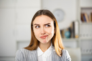 Woman manager expresses various positive emotions in a modern office