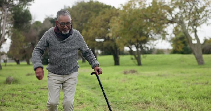 Dance, happy and a man with a cane in nature for comedy, fun and freedom in retirement. Face portrait, walking and a senior person with a stick in a park or garden for a carefree weekend or vacation