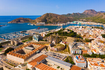 Fototapeta na wymiar Aerial view of Cartagena port city with buildings and coast line, Autonomous Community of Murcia, southeastern Spain..