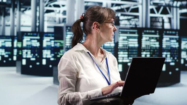 Proficient system administrator looking around revolutionary data center, preparing to start comission on damaged high tech server rackmounts in order to ensure ideal operations