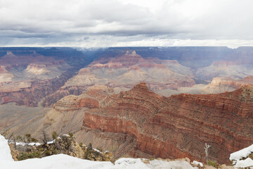 Fototapeta na wymiar Storm clouds over Grand Canyon National Park in winter viewed from the South Rim, Arizona