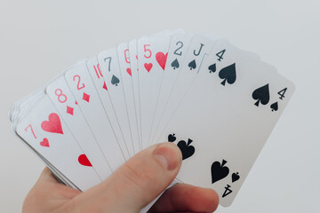 Card games..Table gambling. Card fan in hand