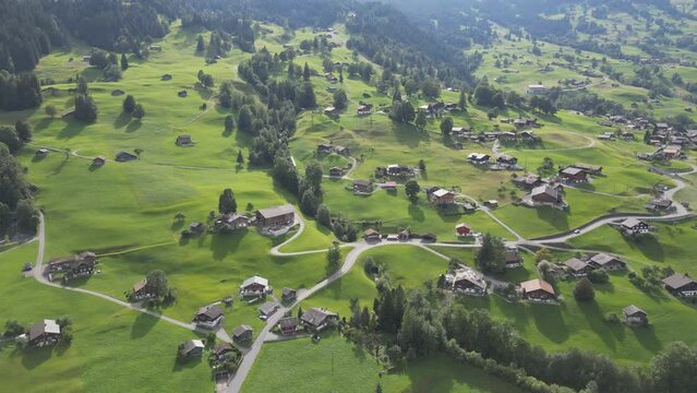 Picture perfect drone footage of a village in the Swiss Alps.