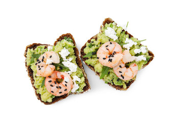 Delicious sandwiches with guacamole, shrimps and black sesame seeds on white background, top view