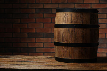 Wooden barrel on table near brick wall, space for text