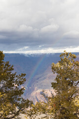 Storm clouds and rainbow over Grand Canyon National Park in winter viewed from the South Rim, Arizona