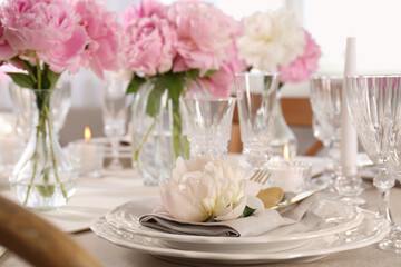 Stylish table setting with beautiful peonies indoors, closeup. Space for text