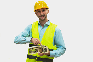 Portrait Cuacasian builder worker man holding house model on white background