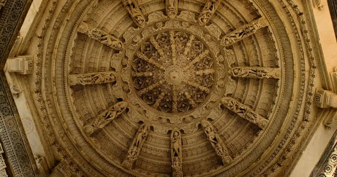 Ceiling of iconic Ranakpur Jain temple or Chaturmukha Dharana Vihara. Marble ancient medieval carved sculpture carvings of sacred religious place of jainism worship. Ranakpur, Rajasthan. India